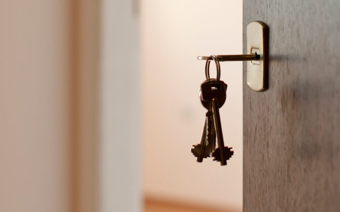 a key inserted in a keyhole of a door of a rental property managed by TESO Property Management in Ellenville
