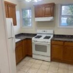 medium size kitchen with oven and refrigerator of a rental property managed by TESO Property Management in Rockland County