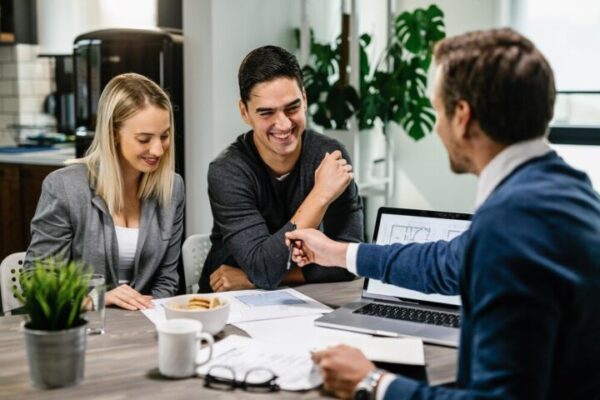 couple talking to a real estate agent