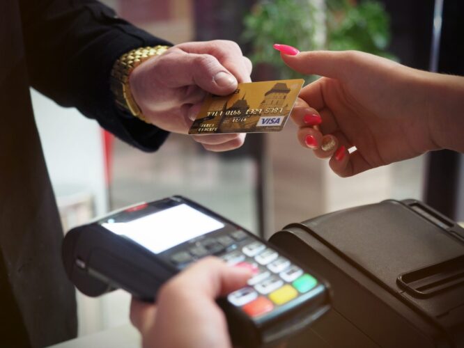 A person lending his card for credit check